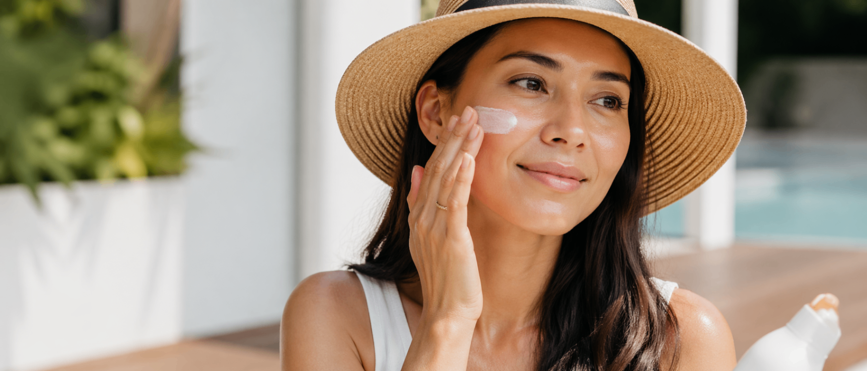 Woman applying sunscreen for daily skin protection — L.I.V.E. Wellness Medspa Rocklin CA