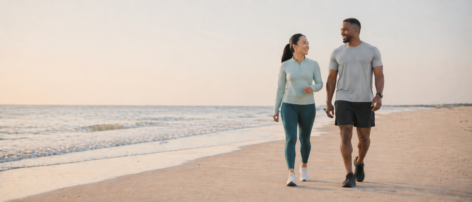 Couple walking together on the beach at sunset — L.I.V.E. Wellness Medspa Rocklin CA